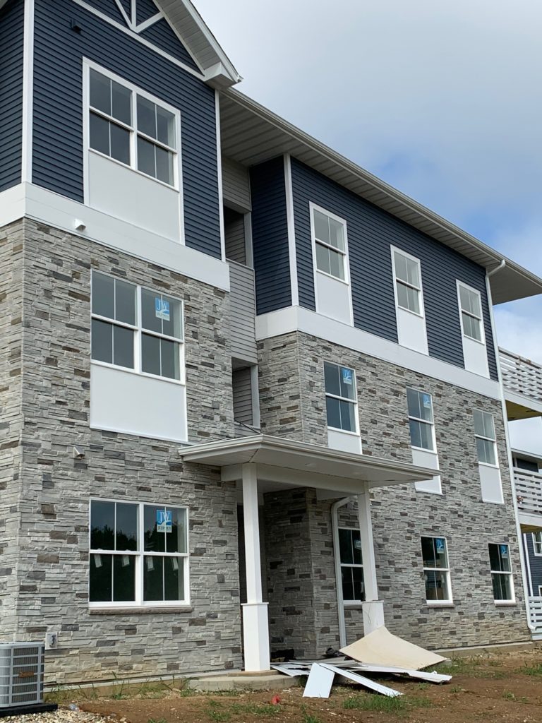 Three-story contemporary multifamily building